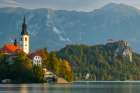 Slovenia, Bled, Lake Bled. Town and island church reflect in lake. Art Print